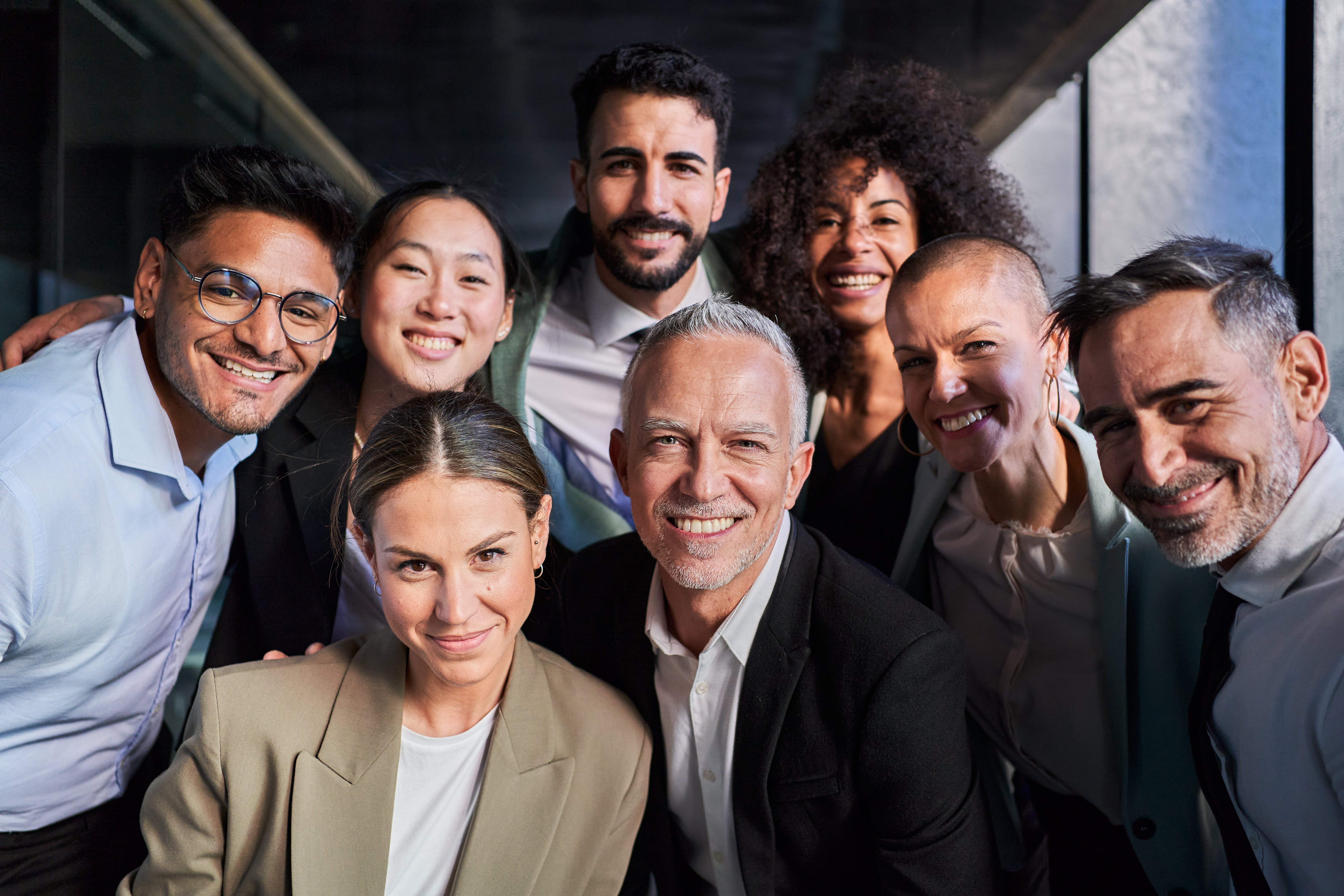 cheerful-portrait-of-group-of-businesspeople-takin-2024-12-08-01-10-25-utc